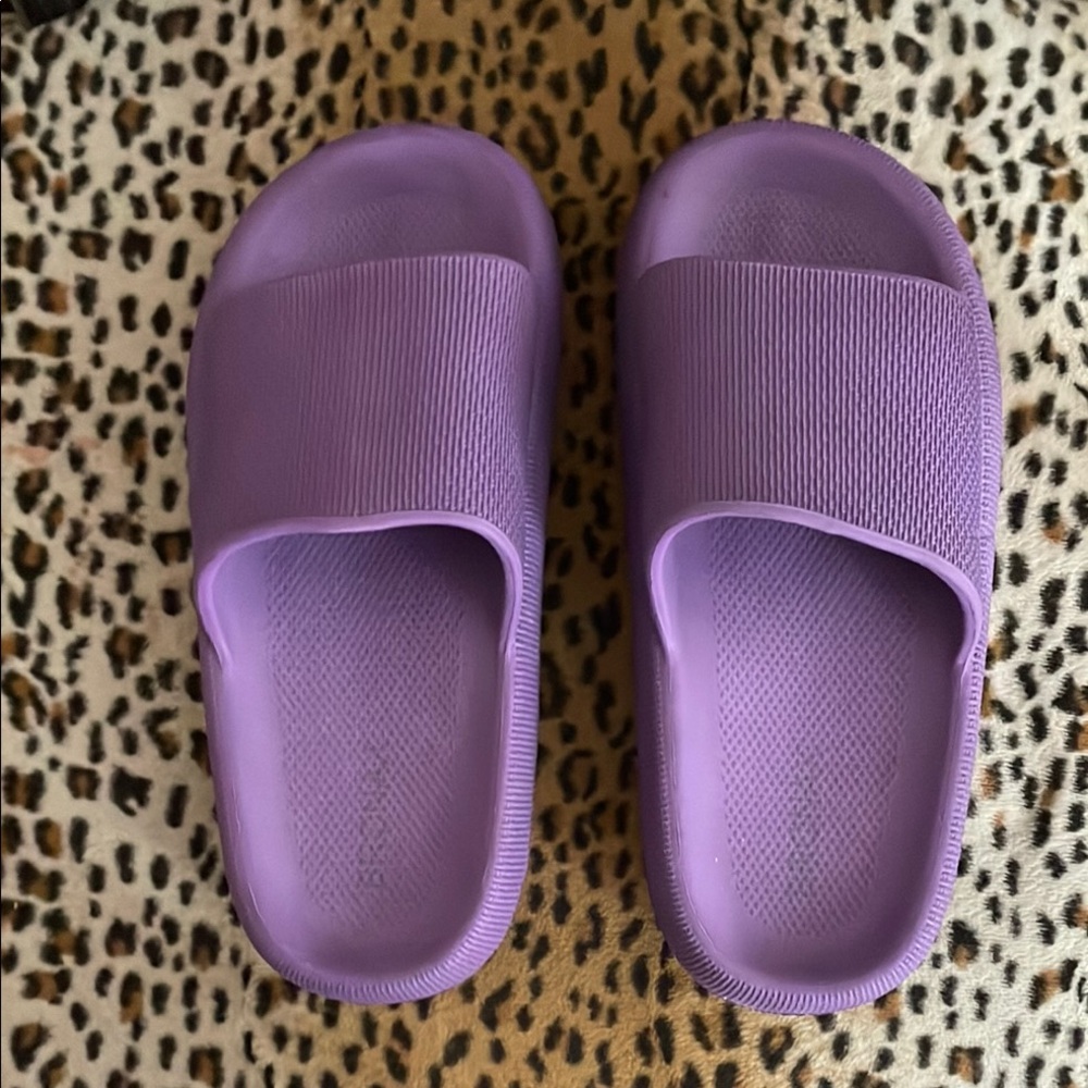 Purple slides, cushy, and comfortable